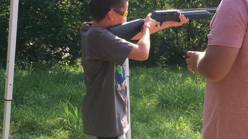 Youth shooting at target