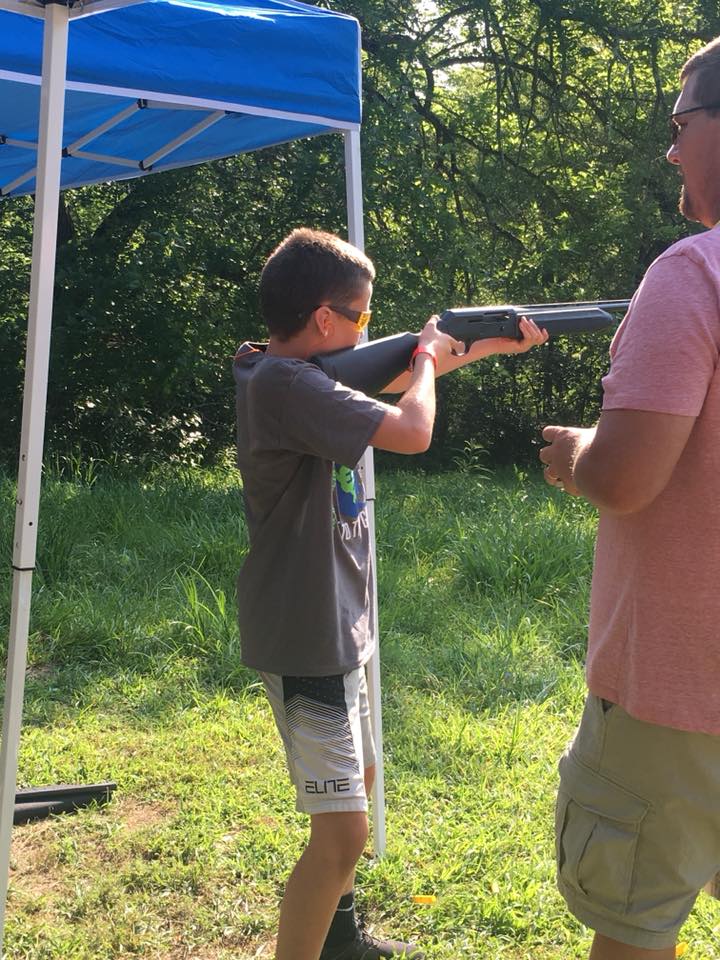 Youth shooting at target