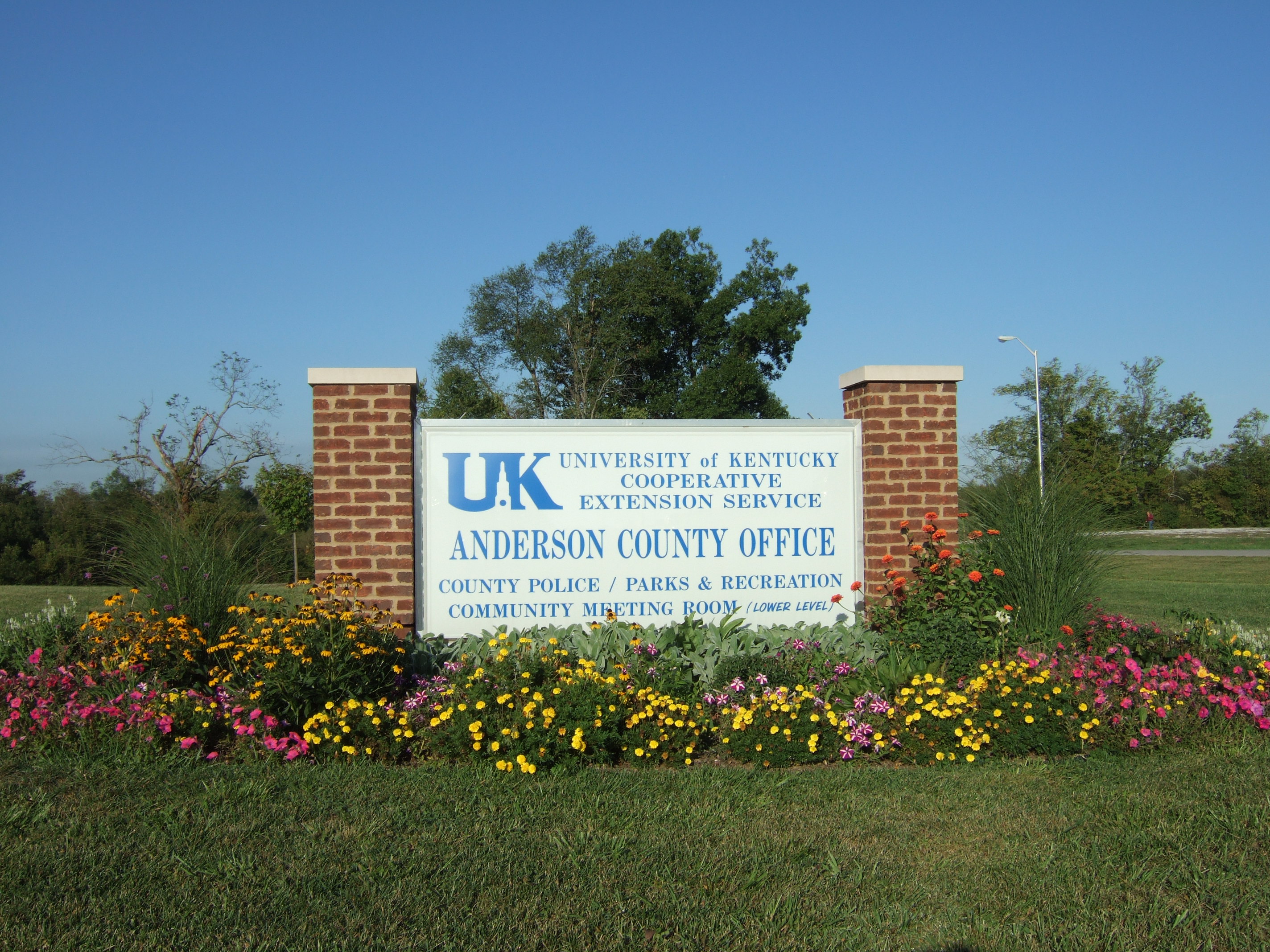 Photo of outside sign and flowers
